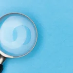 magnifying glass on blue background