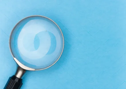 magnifying glass on blue background
